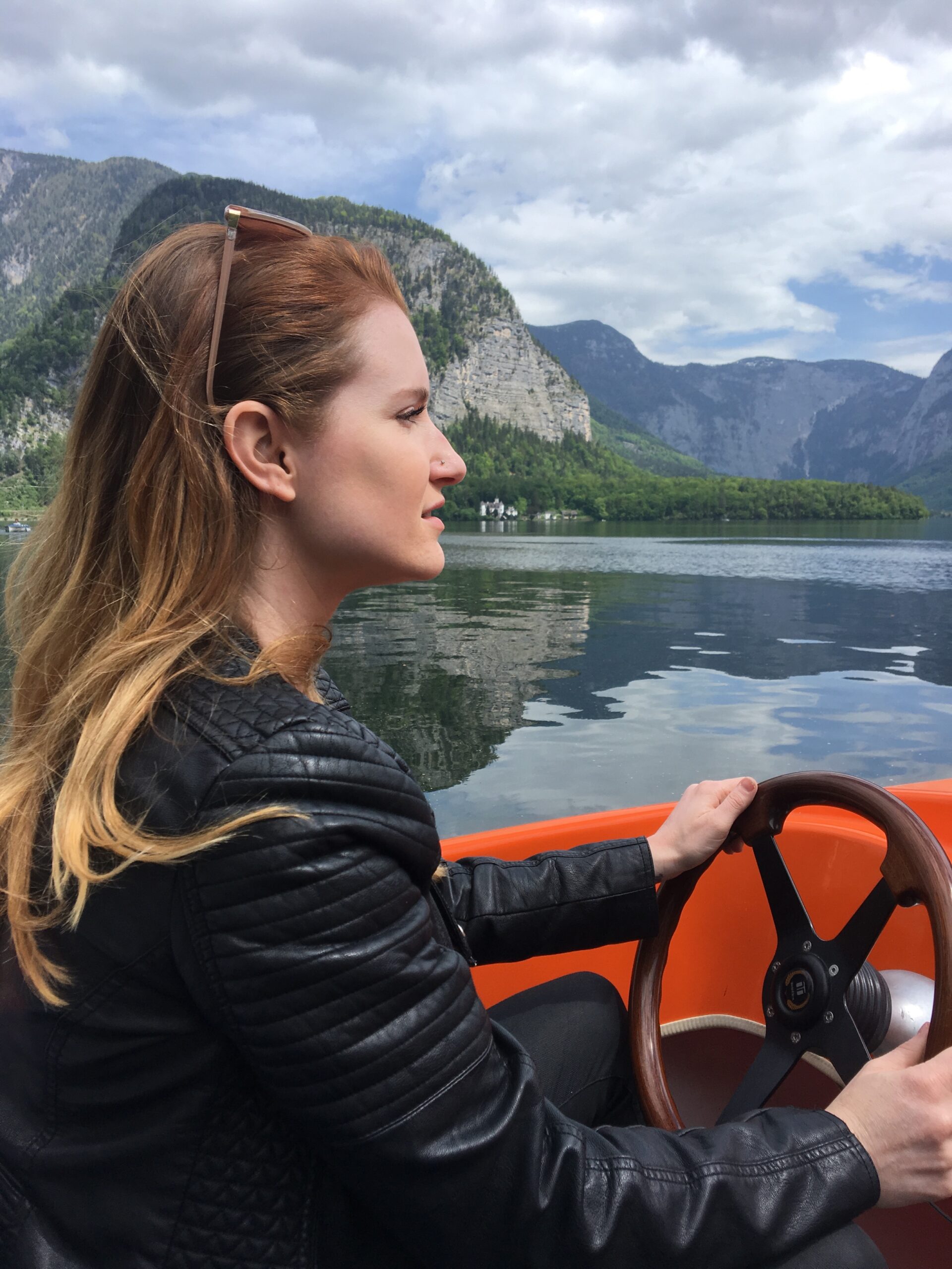 a person sitting in front of a body of water