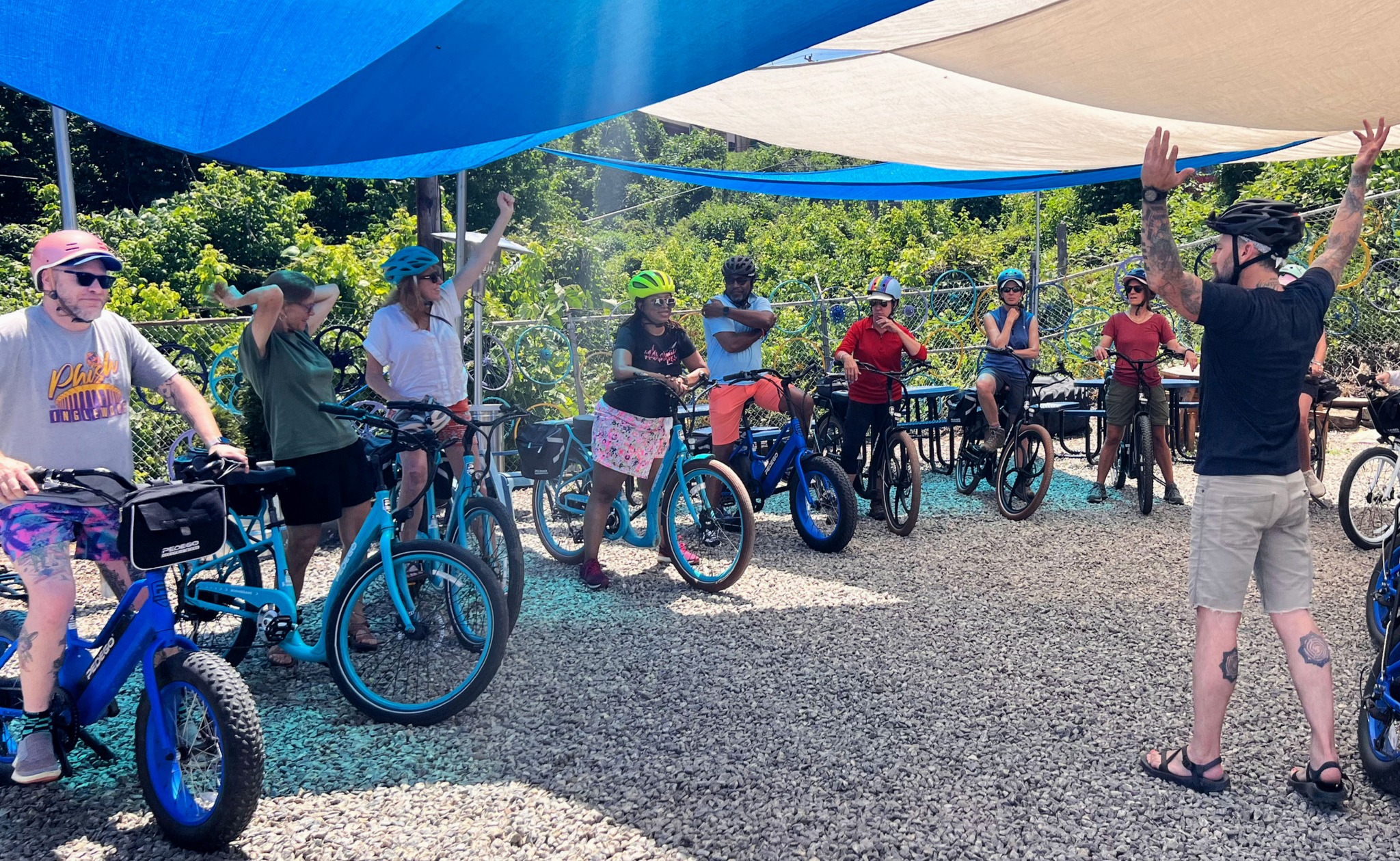 a group of people standing next to a bicycle