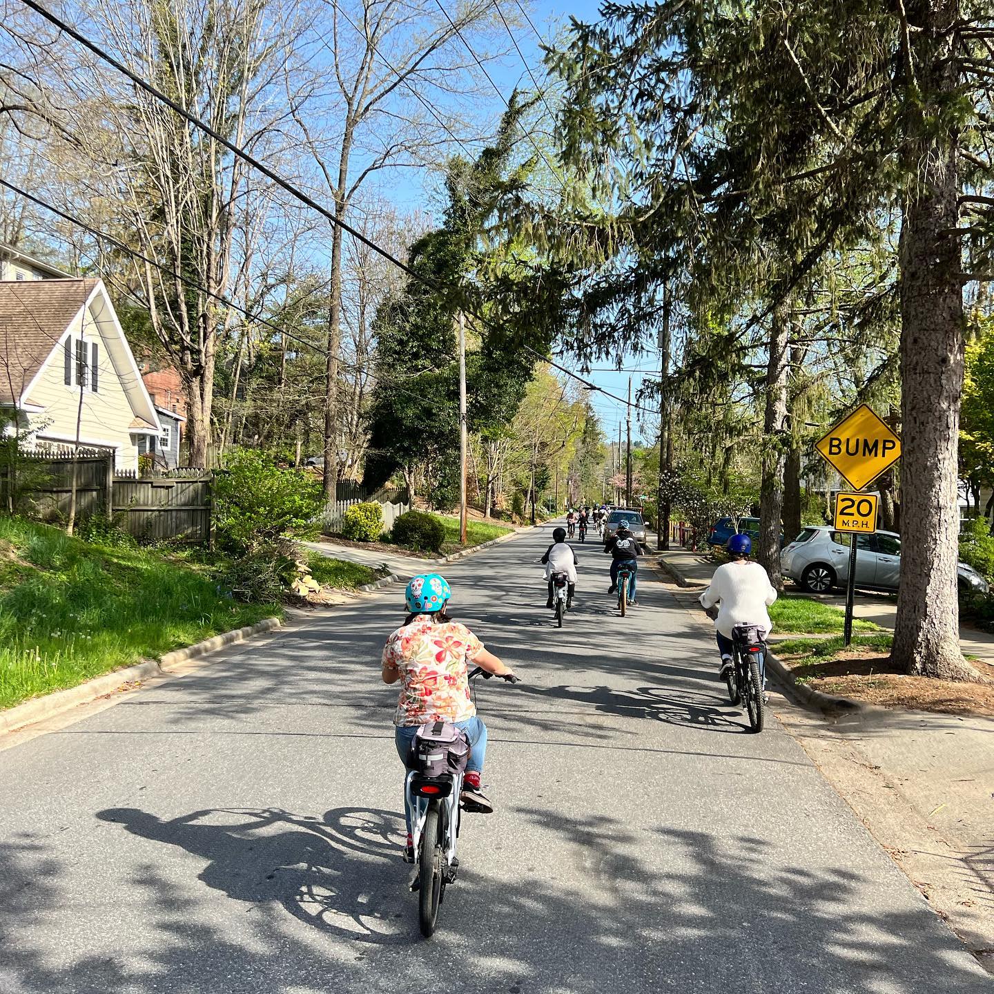 a person riding a bike down a dirt road