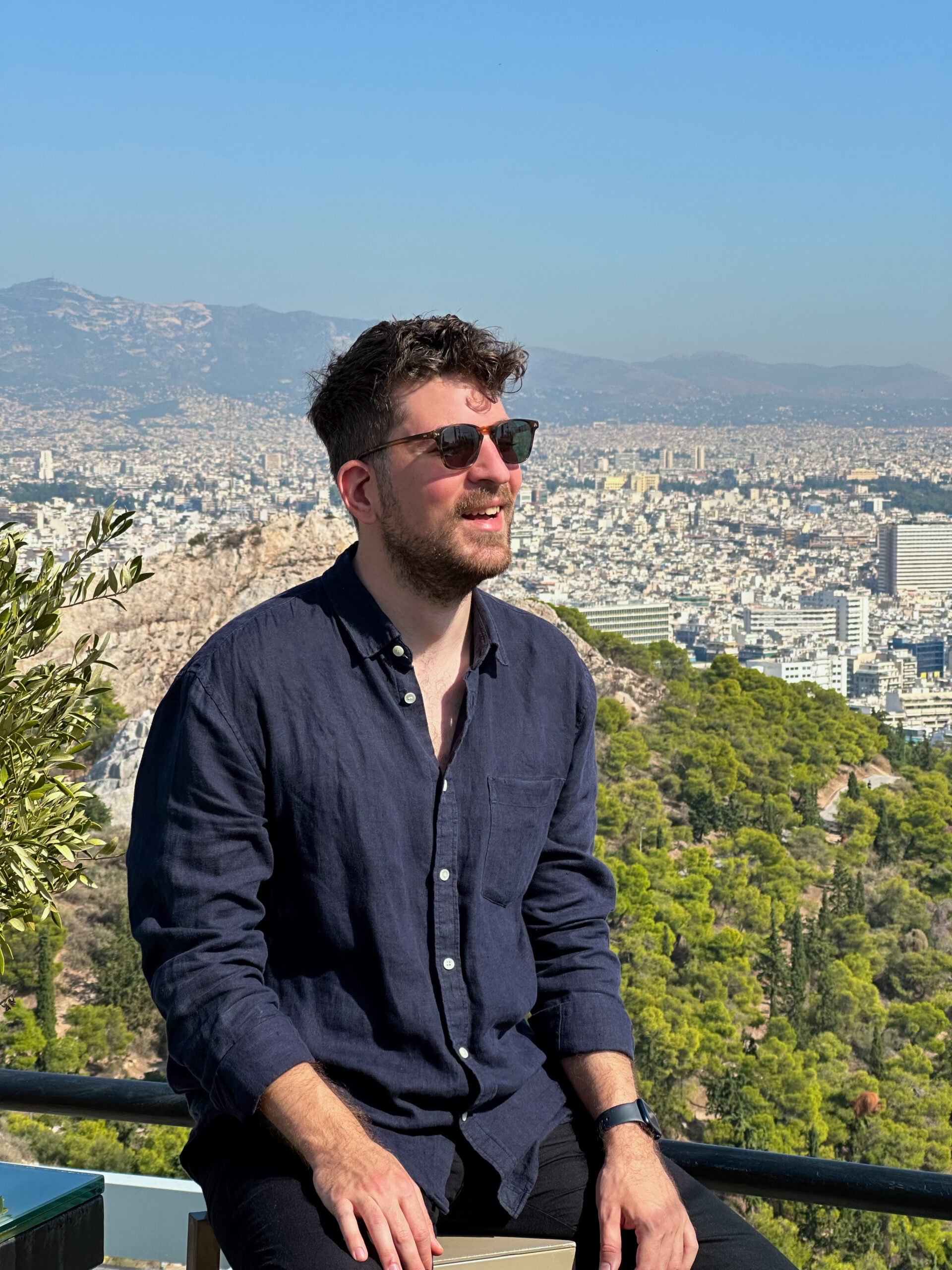 a man standing in front of a mountain