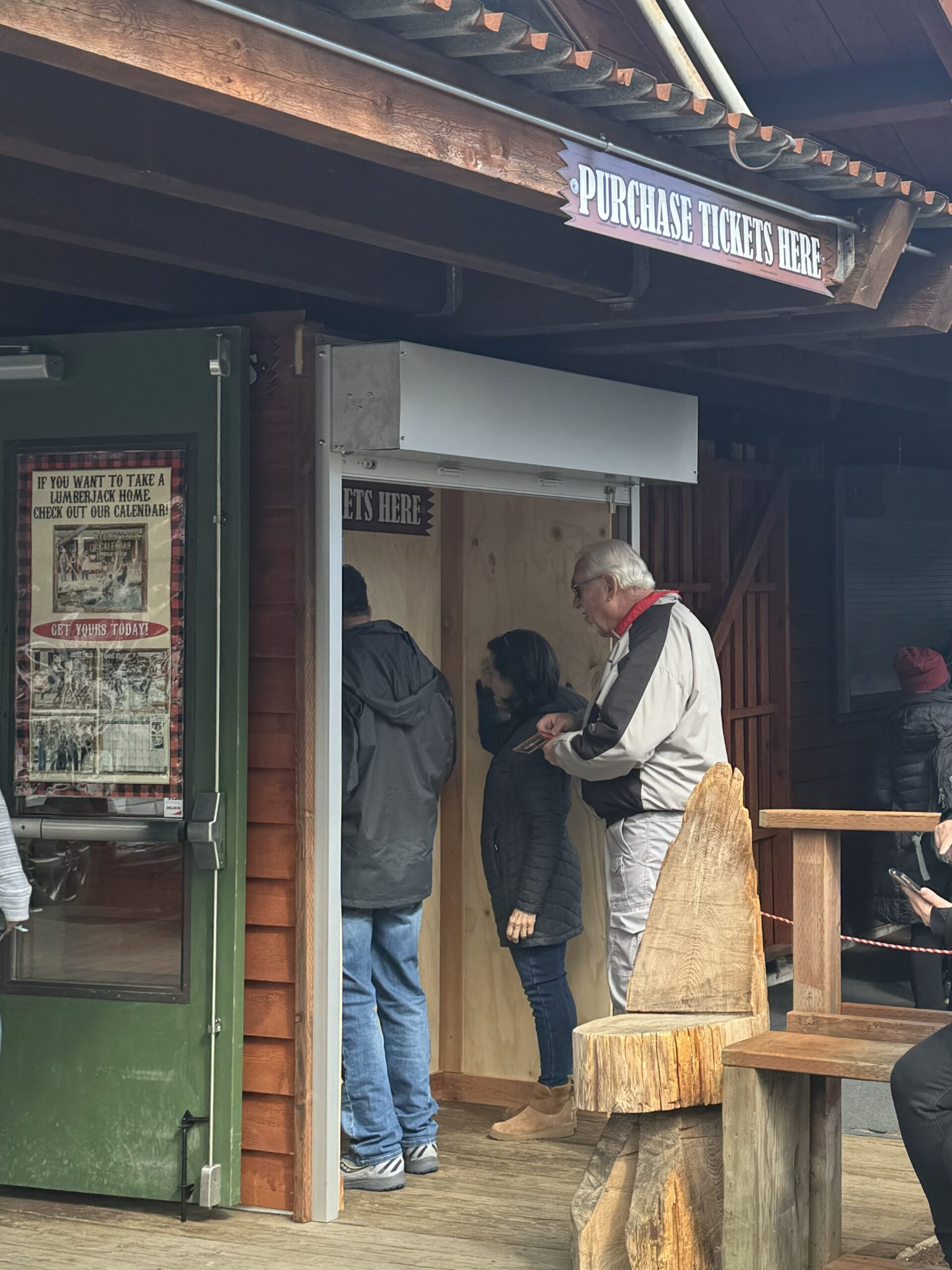 a man standing in front of kiosk booking booth