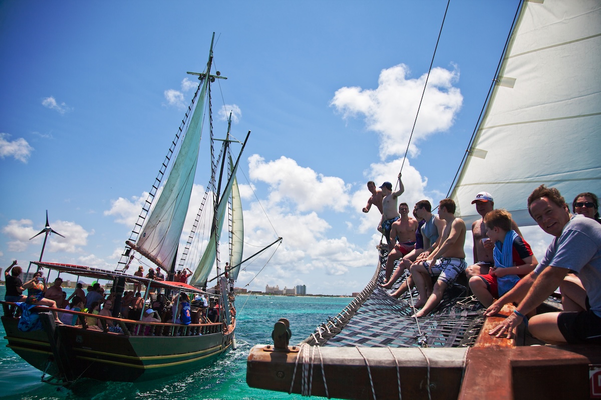 a group of people on a boat in the water